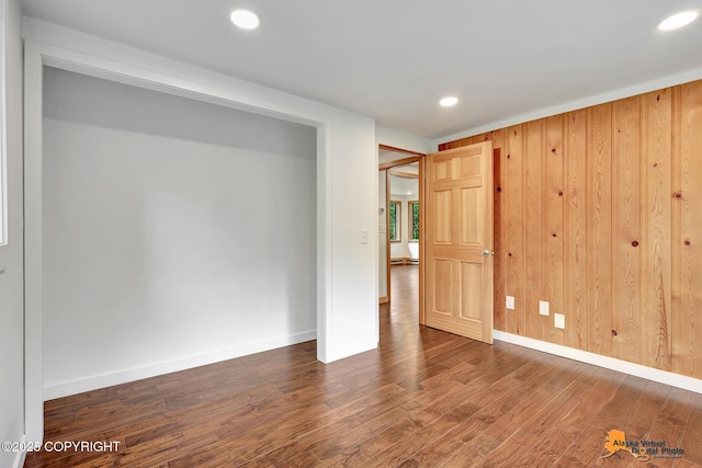 2641 W 27th Ave, Anchorage, AK 99517 - unfurnished room with wood finished floors, recessed lighting, and wooden walls