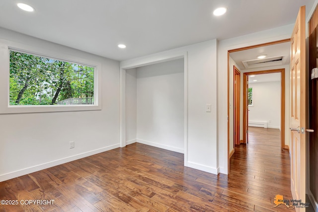 2641 W 27th Ave, Anchorage, AK 99517 - unfurnished bedroom featuring recessed lighting, dark wood-type flooring, a baseboard radiator, and attic access