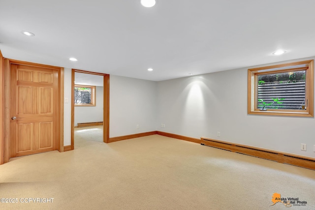 2641 W 27th Ave, Anchorage, AK 99517 - spare room with baseboard heating, carpet, recessed lighting, and a baseboard radiator