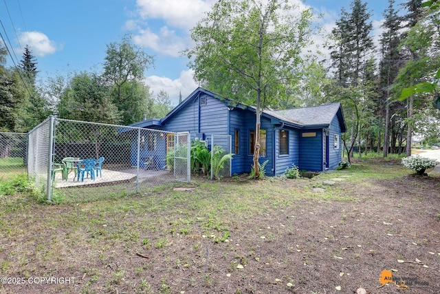 2641 W 27th Ave, Anchorage, AK 99517 - back of house featuring a patio