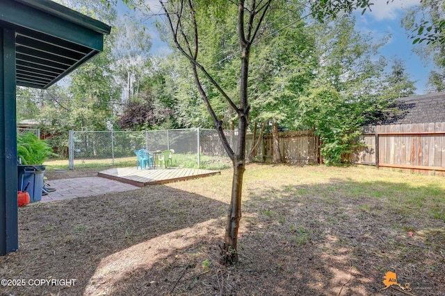 2641 W 27th Ave, Anchorage, AK 99517 - fenced backyard with a wooden deck and a patio
