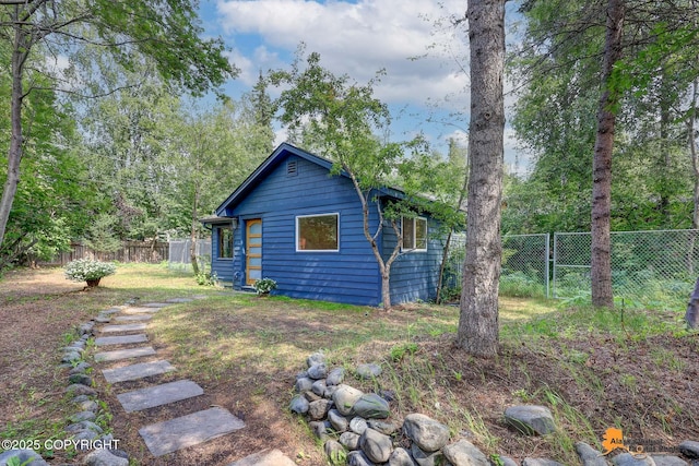 2641 W 27th Ave, Anchorage, AK 99517 - rear view of property with a fenced backyard