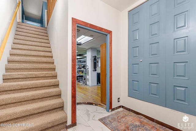 22432 Glacier View Dr, Eagle River, AK 99577 - entrance foyer with marble look tiles and stairs