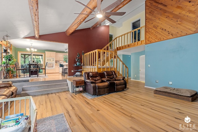 22432 Glacier View Dr, Eagle River, AK 99577 - living area featuring light wood-style flooring, a chandelier, stairway, and a ceiling fan