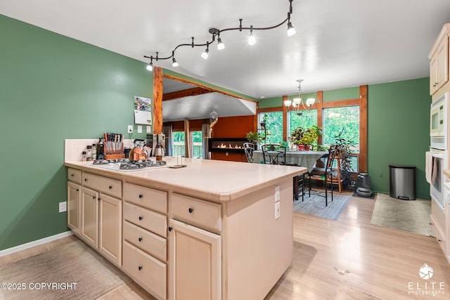 22432 Glacier View Dr, Eagle River, AK 99577 - kitchen featuring white appliances, a chandelier, light wood-type flooring, and light countertops