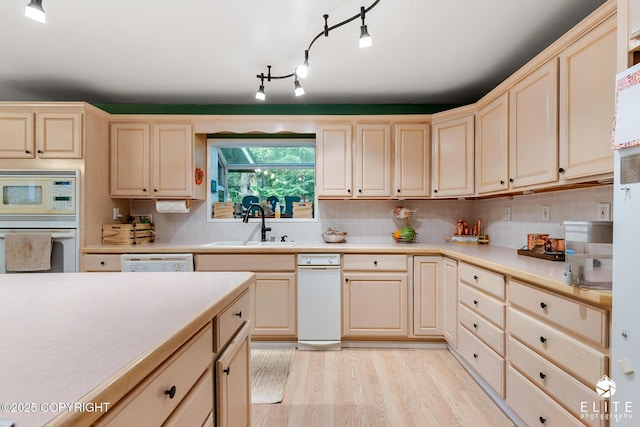 22432 Glacier View Dr, Eagle River, AK 99577 - kitchen featuring white appliances, light countertops, light wood-style flooring, and backsplash