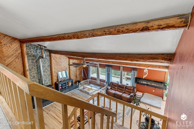 22432 Glacier View Dr, Eagle River, AK 99577 - living room with wooden walls, beam ceiling, and ceiling fan