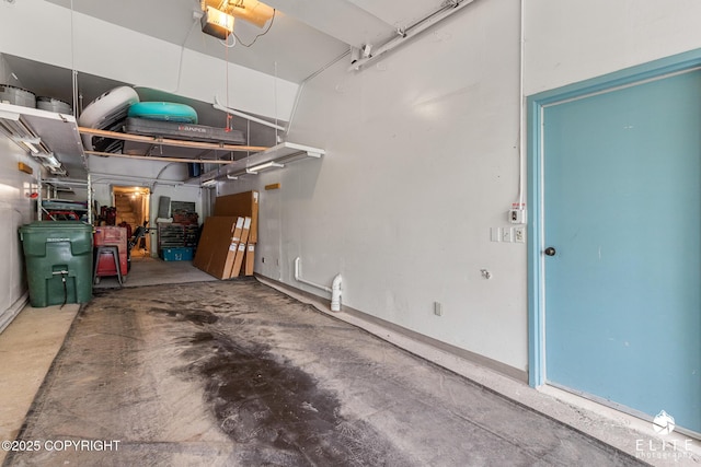 22432 Glacier View Dr, Eagle River, AK 99577 - garage featuring a garage door opener and baseboards