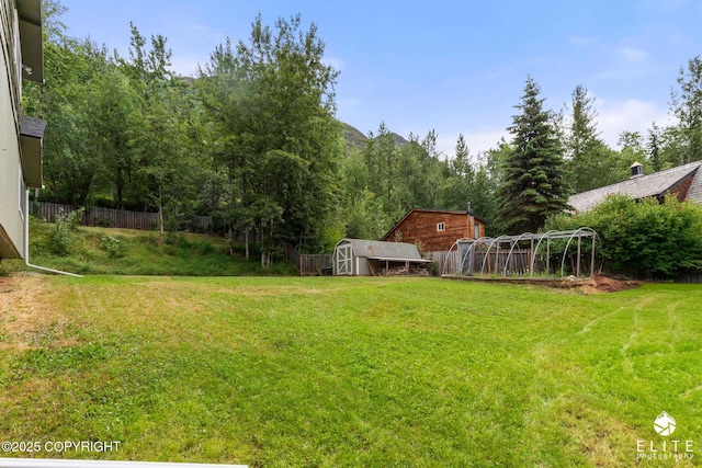 22432 Glacier View Dr, Eagle River, AK 99577 - view of yard featuring a storage unit