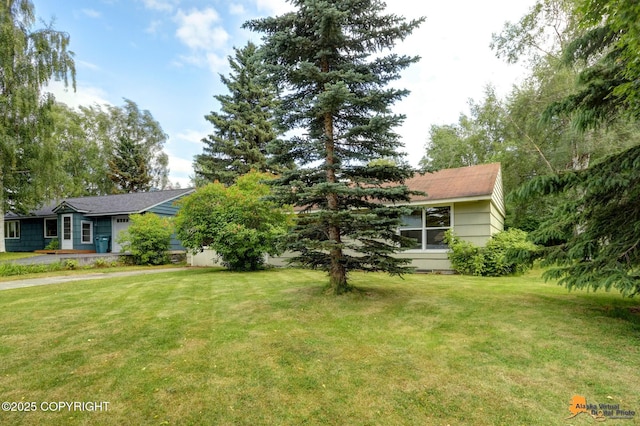4905 Roger Dr, Anchorage, AK 99507 - view of front of house featuring a front lawn