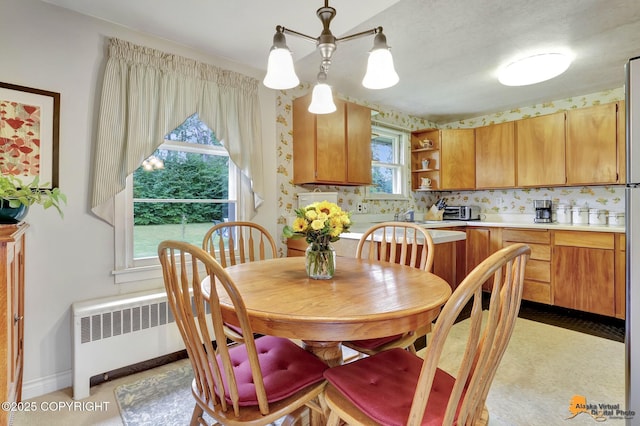 4905 Roger Dr, Anchorage, AK 99507 - dining area with radiator heating unit and baseboards
