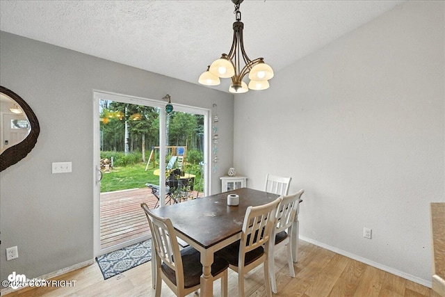 34443 Matanuska St, Soldotna, AK 99669 - dining area with a chandelier and light wood-style floors