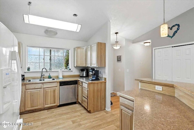 34443 Matanuska St, Soldotna, AK 99669 - kitchen with lofted ceiling, light wood-style floors, white refrigerator with ice dispenser, a skylight, and dishwasher