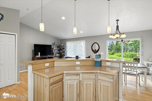 34443 Matanuska St, Soldotna, AK 99669 - kitchen featuring light brown cabinetry, light wood finished floors, light countertops, recessed lighting, and a textured ceiling