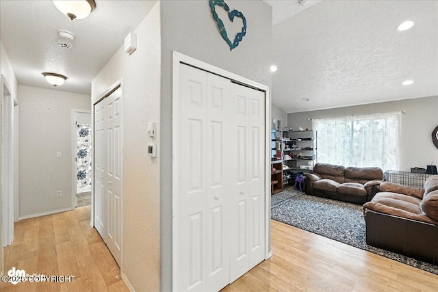 34443 Matanuska St, Soldotna, AK 99669 - corridor featuring a textured ceiling, light wood-style floors, and recessed lighting