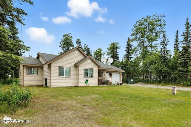 34443 Matanuska St, Soldotna, AK 99669 - view of front facade featuring a garage, driveway, a front lawn, and roof with shingles