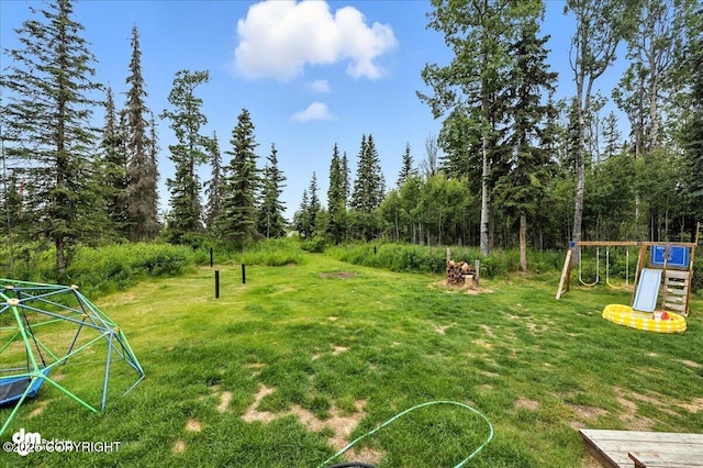 34443 Matanuska St, Soldotna, AK 99669 - view of grassy yard with a playground
