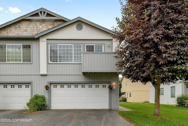 5586 Sapphire Loop # 55B, Anchorage, AK 99504 - view of front of property with an attached garage, a front lawn, and driveway