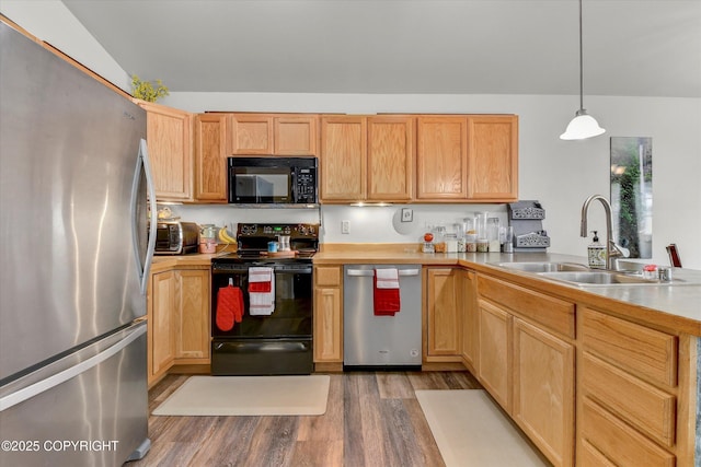 5586 Sapphire Loop # 55B, Anchorage, AK 99504 - kitchen with black appliances, light wood-style flooring, light countertops, a peninsula, and hanging light fixtures
