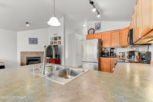 5586 Sapphire Loop # 55B, Anchorage, AK 99504 - kitchen with freestanding refrigerator, electric stove, black microwave, a fireplace, and vaulted ceiling