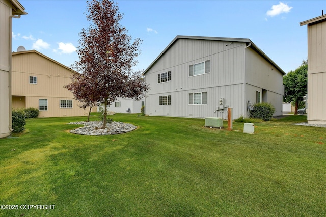 5586 Sapphire Loop # 55B, Anchorage, AK 99504 - back of house featuring a lawn