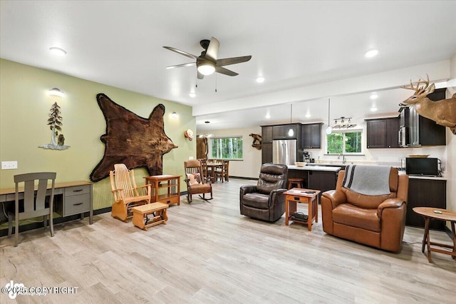 5551 N Wildwood Dr, Wasilla, AK 99654 - living room featuring a ceiling fan, light wood-type flooring, and recessed lighting