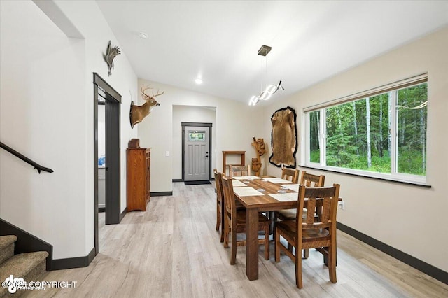 5551 N Wildwood Dr, Wasilla, AK 99654 - dining room with light wood-type flooring, stairs, and lofted ceiling