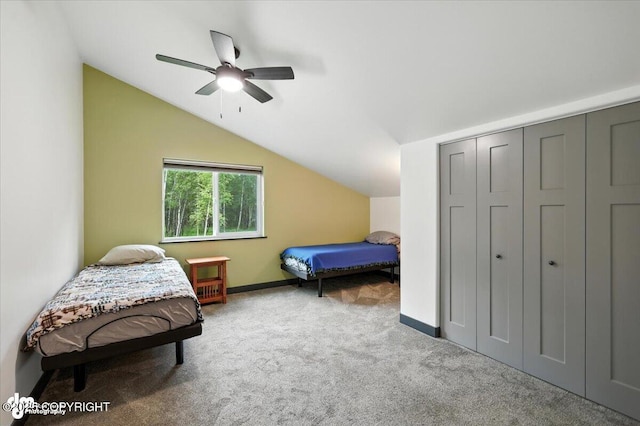 5551 N Wildwood Dr, Wasilla, AK 99654 - bedroom with carpet flooring, vaulted ceiling, a closet, and ceiling fan