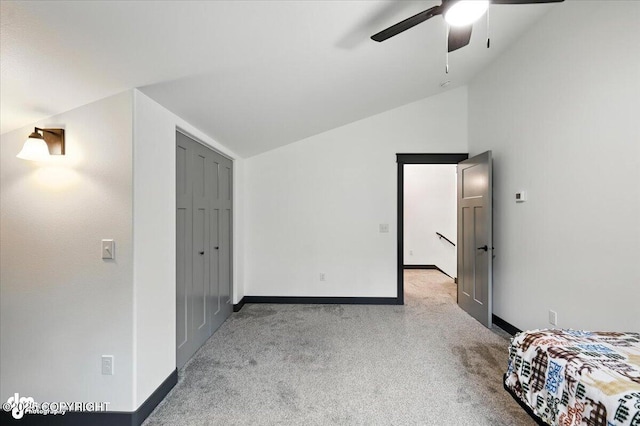 5551 N Wildwood Dr, Wasilla, AK 99654 - unfurnished bedroom with lofted ceiling, carpet, and ceiling fan