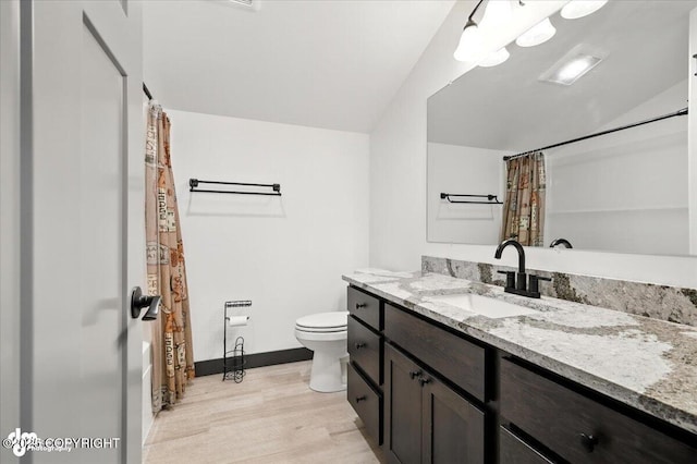 5551 N Wildwood Dr, Wasilla, AK 99654 - full bathroom featuring wood finished floors, vanity, and a shower with shower curtain