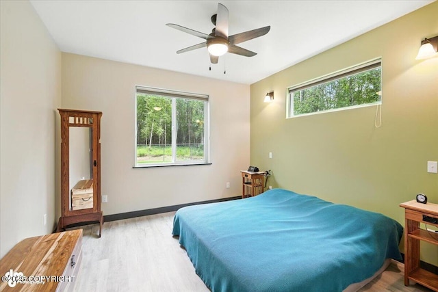5551 N Wildwood Dr, Wasilla, AK 99654 - bedroom with light wood-type flooring and ceiling fan