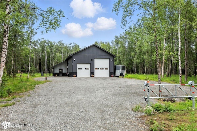 5551 N Wildwood Dr, Wasilla, AK 99654 - detached garage with a wooded view