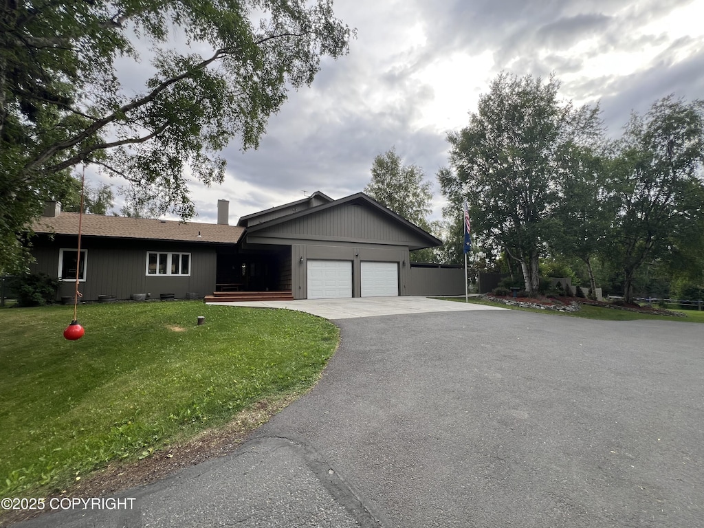 4200 Rabbit Creek Rd, Anchorage, AK 99516 - single story home with asphalt driveway, a garage, and a front yard