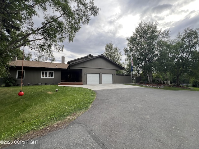 4200 Rabbit Creek Rd, Anchorage, AK 99516 - single story home with asphalt driveway, a garage, and a front yard