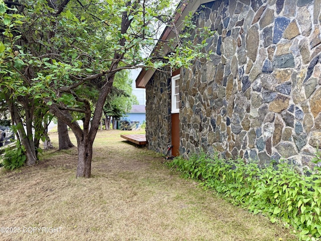 290 Park St, Anchorage, AK 99508 - view of grassy yard with a wooden deck