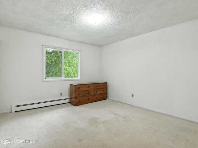 9801 Whitefish Cir, Anchorage, AK 99515 - carpeted empty room with a baseboard radiator and a textured ceiling