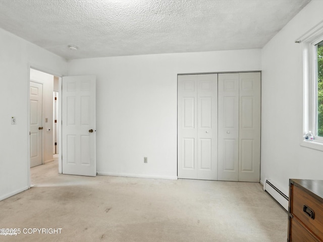 9801 Whitefish Cir, Anchorage, AK 99515 - unfurnished bedroom featuring a baseboard heating unit, a closet, light carpet, and a textured ceiling