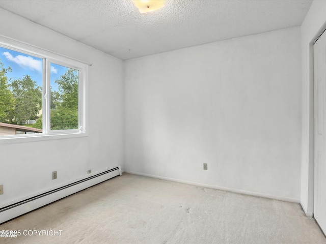 9801 Whitefish Cir, Anchorage, AK 99515 - unfurnished room featuring a baseboard radiator, carpet, and a textured ceiling