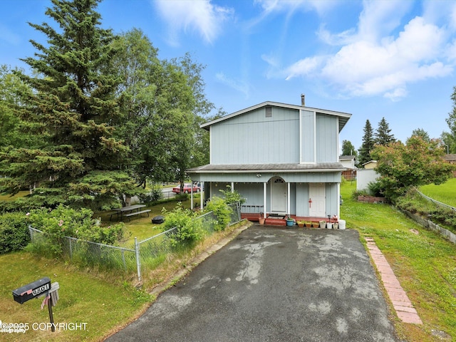 9801 Whitefish Cir, Anchorage, AK 99515 - view of front of house featuring covered porch and asphalt driveway