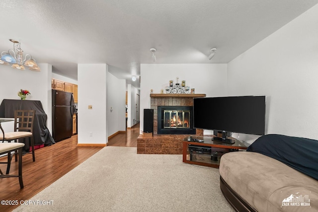 8641 Blackberry St # 6B, Anchorage, AK 99502 - living room with wood finished floors and a brick fireplace