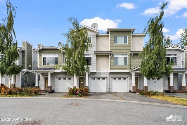 7655 Stepping Stone Ln Unit Q2, Anchorage, AK 99504 - view of property featuring driveway, an attached garage, and stone siding