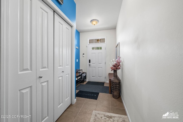 7655 Stepping Stone Ln Unit Q2, Anchorage, AK 99504 - entryway with tile patterned floors and baseboards