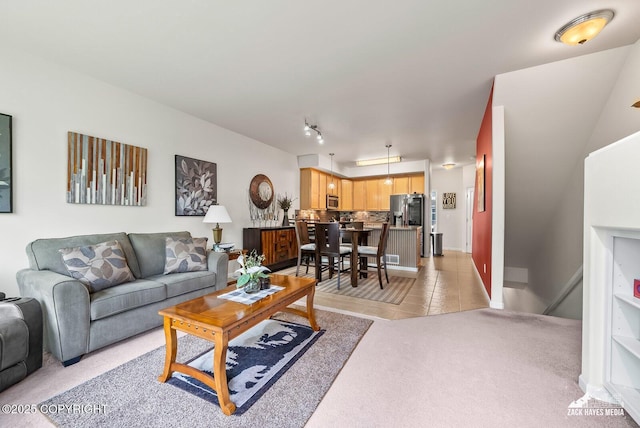 7655 Stepping Stone Ln Unit Q2, Anchorage, AK 99504 - living room with light tile patterned floors and light carpet
