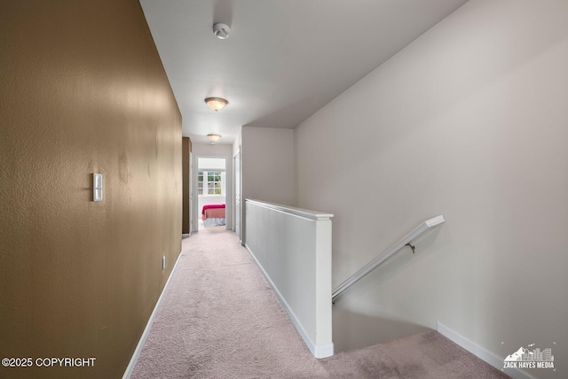 7655 Stepping Stone Ln Unit Q2, Anchorage, AK 99504 - corridor featuring an upstairs landing and carpet floors