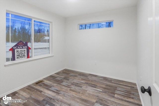 4125 E Zircon Cir, Wasilla, AK 99654 - unfurnished room featuring wood finished floors and baseboards