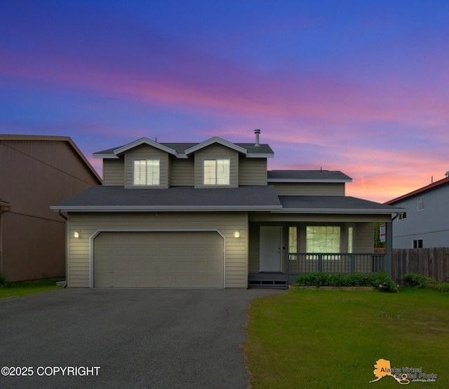 2321 Lusardi Point Cir, Anchorage, AK 99515 - traditional-style house with covered porch, a garage, and asphalt driveway