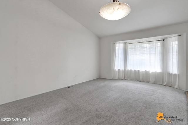 2321 Lusardi Point Cir, Anchorage, AK 99515 - carpeted empty room featuring vaulted ceiling