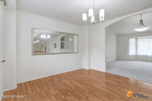 2321 Lusardi Point Cir, Anchorage, AK 99515 - unfurnished room featuring a chandelier and wood finished floors