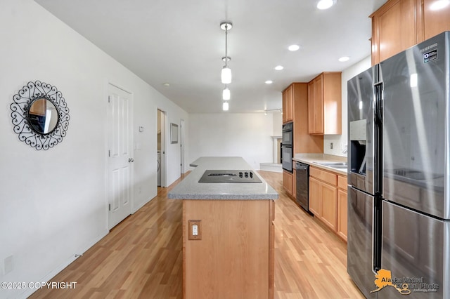 2321 Lusardi Point Cir, Anchorage, AK 99515 - kitchen with black appliances, light wood-style flooring, a kitchen island, pendant lighting, and recessed lighting