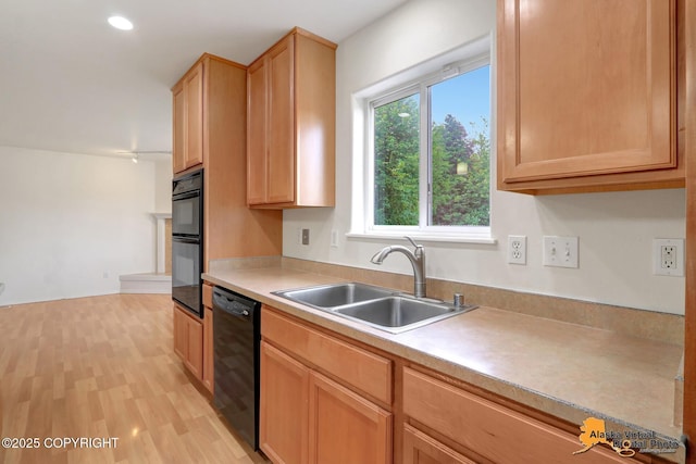 2321 Lusardi Point Cir, Anchorage, AK 99515 - kitchen with black appliances, light countertops, light wood-type flooring, light brown cabinetry, and recessed lighting